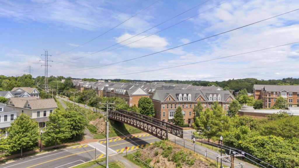 Aerial view of townhomes and a trail bridge in Herndon, Virginia.