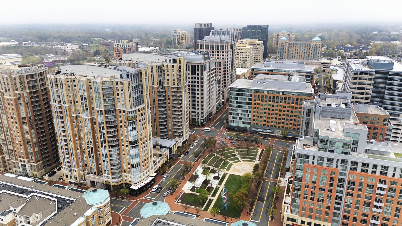 Aerial view of high-rise condo and apartment buildings around Reston Town Center.