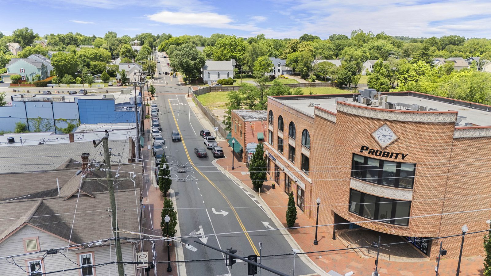 Aerial view of downtown Herndon, Virginia, with tree-lined streets of houses.